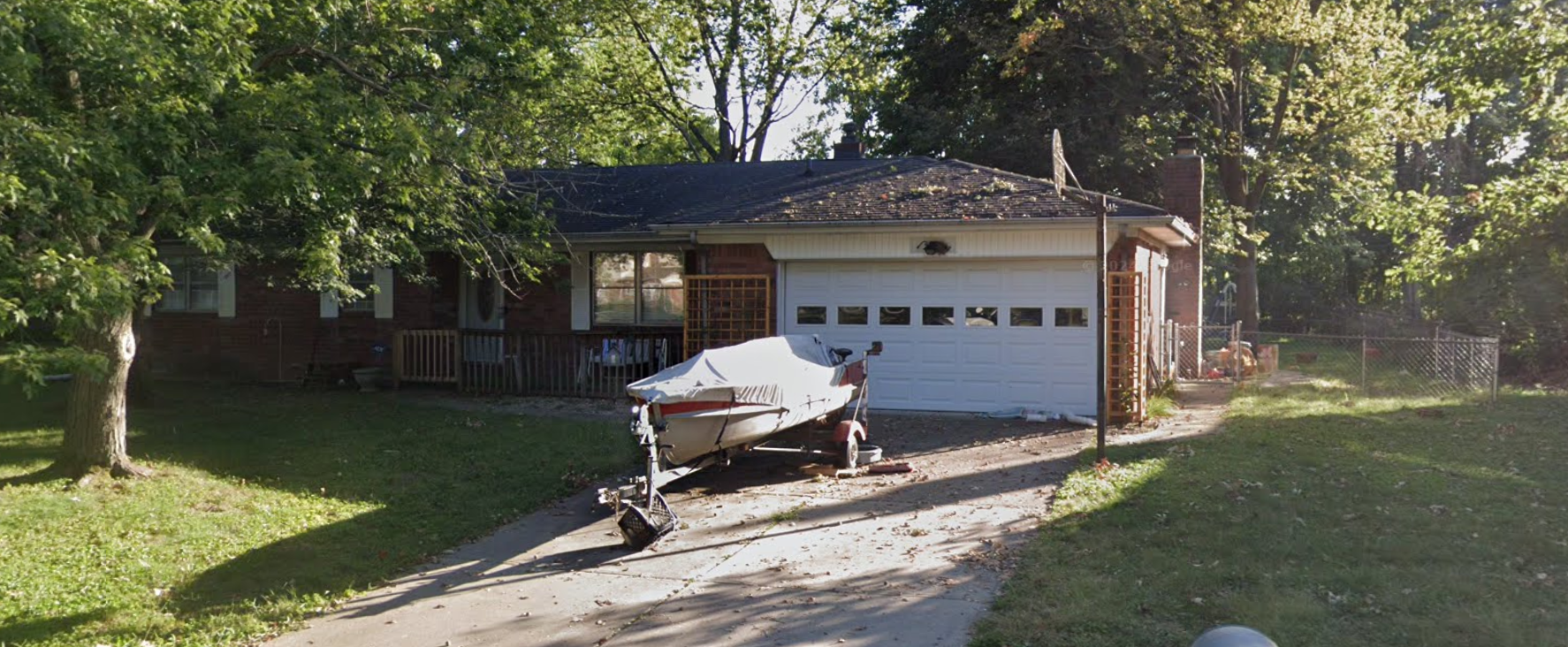 Brick home before roof replacement