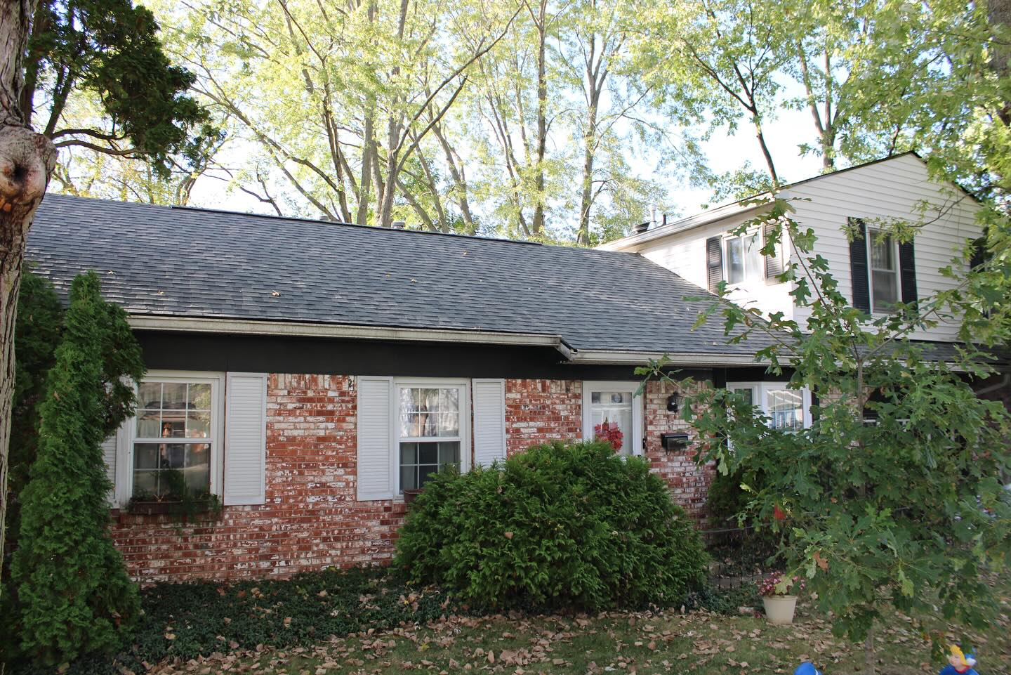 Completed two-story brick and siding home roof replacement