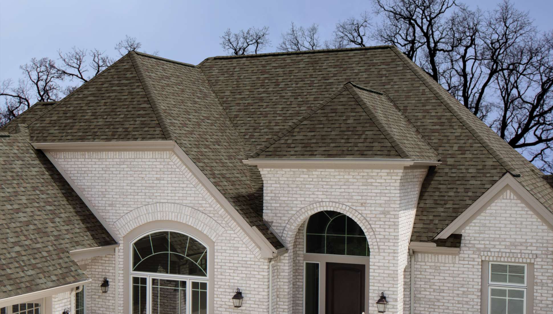 Professional roofing contractors working on residential homes - from construction to completion