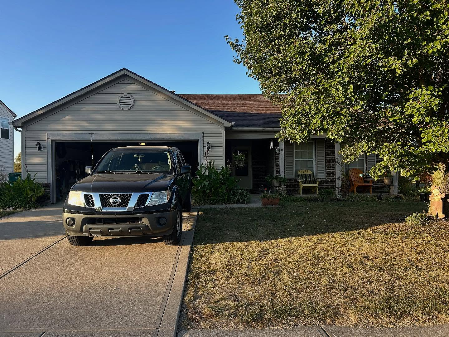 Completed gray siding home roof replacement