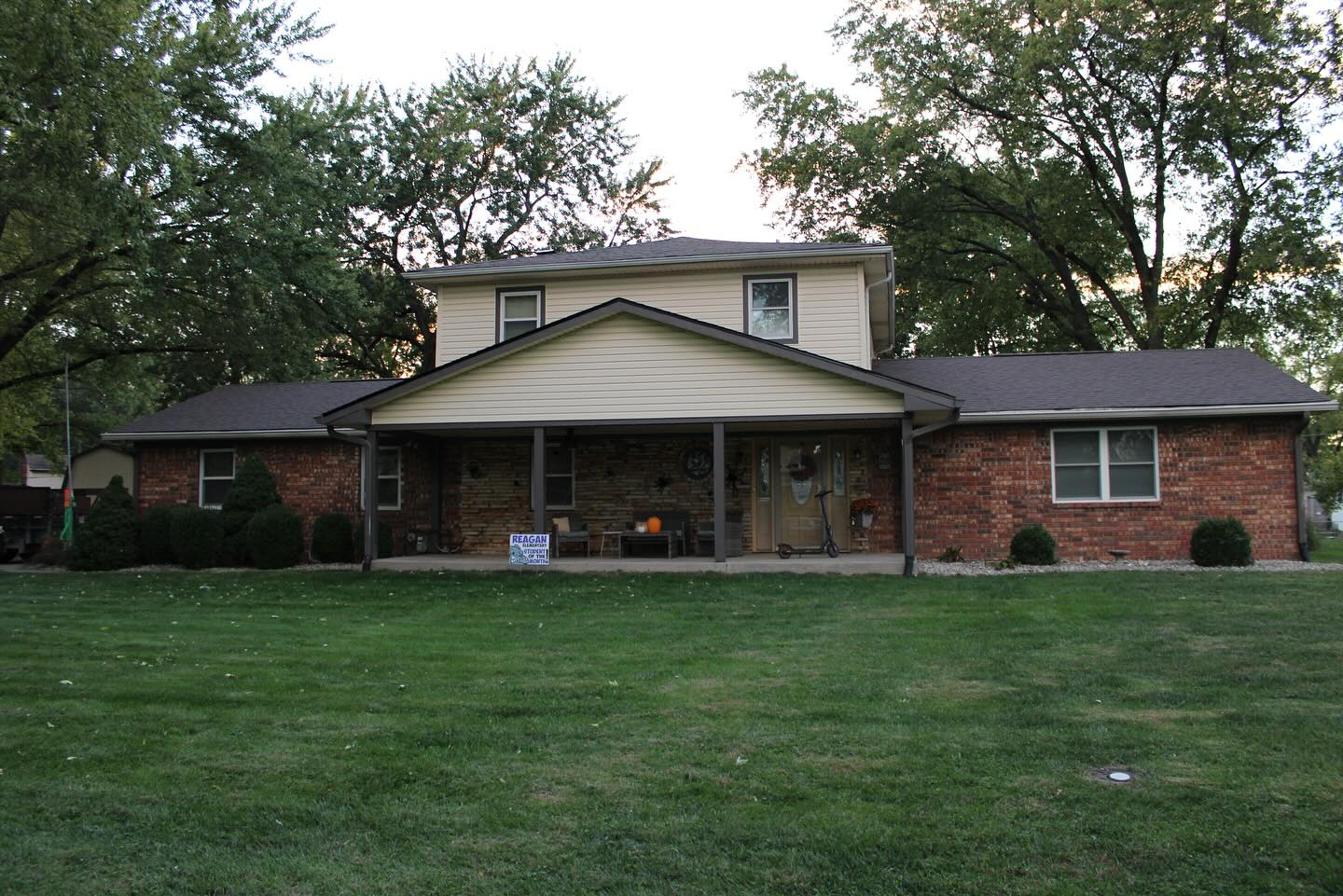 Completed two-story brick home roof replacement